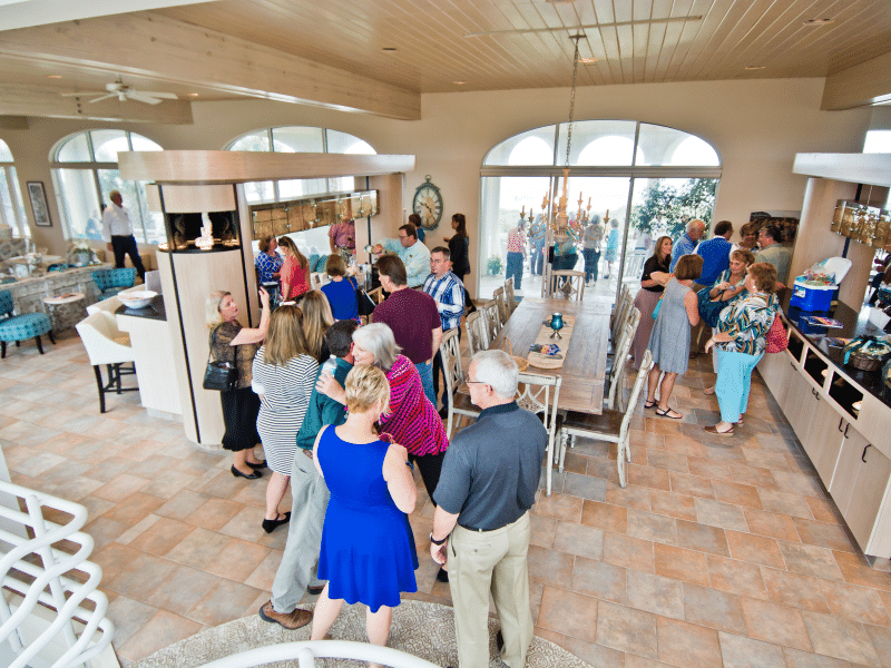 Guests chatting and mingling during an event at Chateau of the Isle in Indian Beach NC