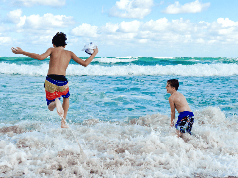 fun on the beach, playing in the ocean, vacation checklist fun